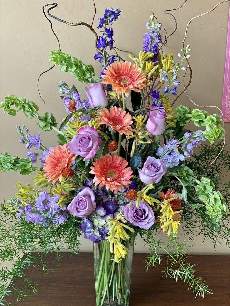 Solve Happiness is....Charming Coloured Flower Arrangement. jigsaw