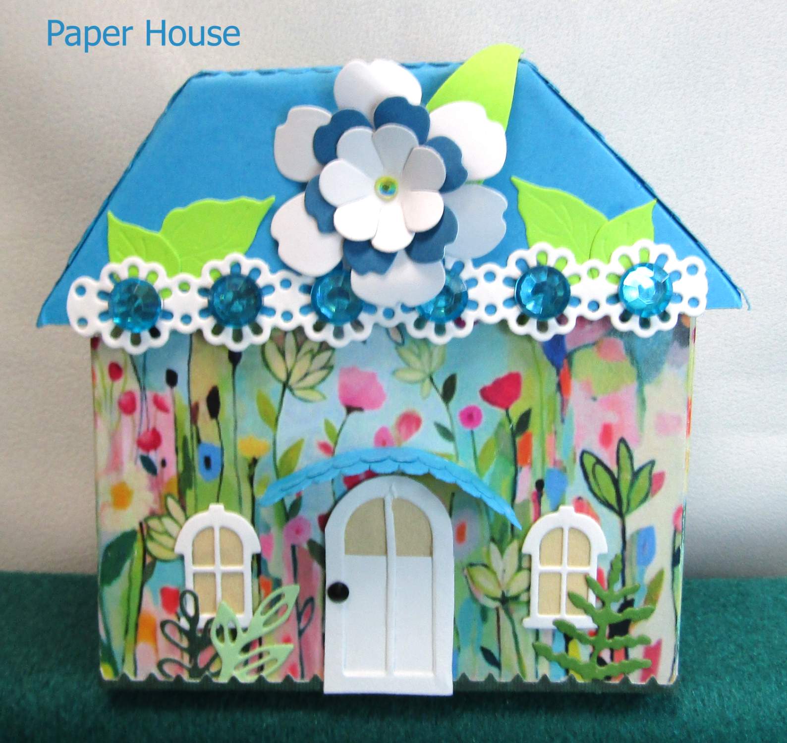 Solve puzzle blue paper house jigsaw puzzle online with 210 pieces