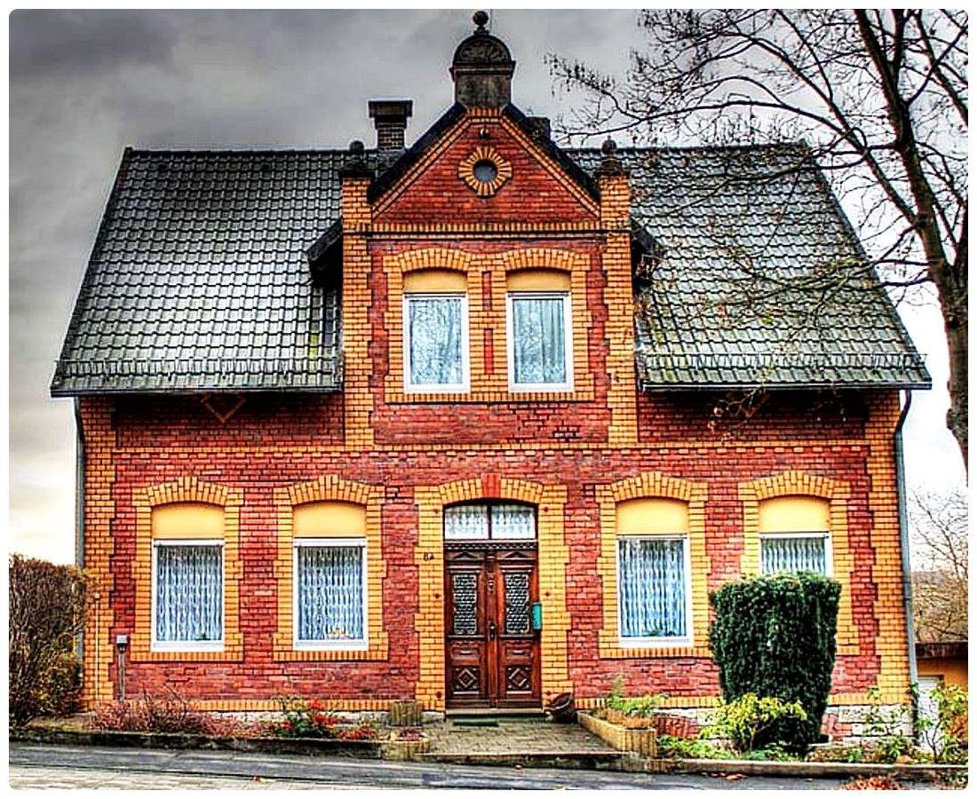 Solve Beautiful Old Red Brick House with Tiled Roof jigsaw puzzle