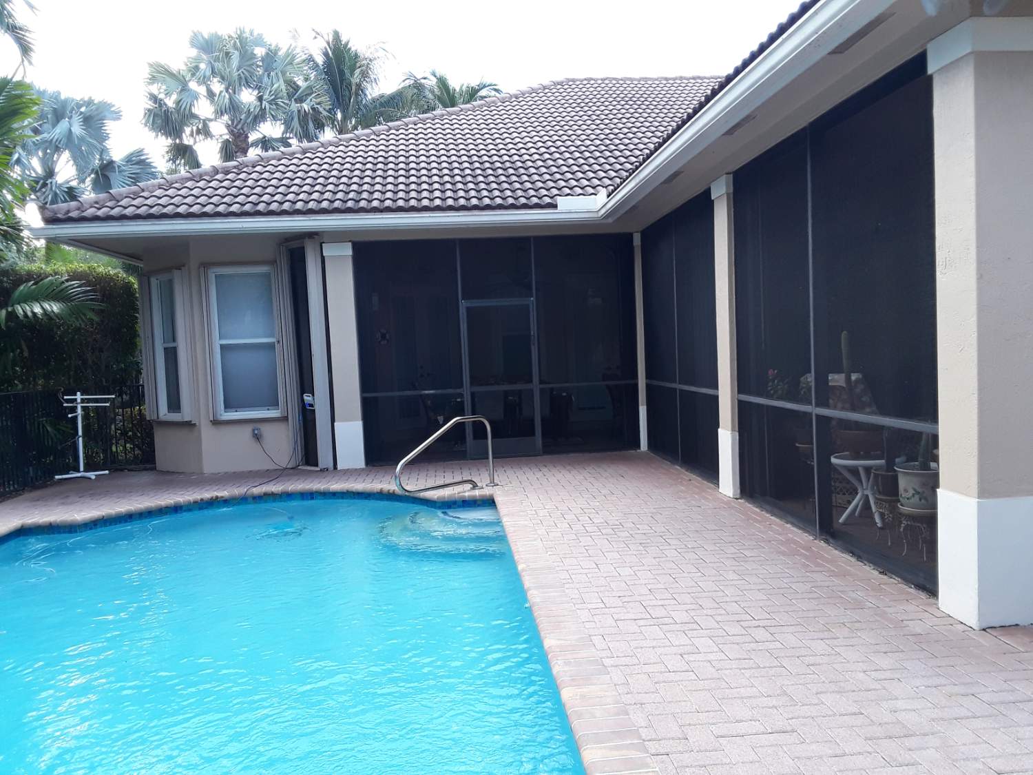 Solve Back view of new railing by pool entrance and a small part of our ...