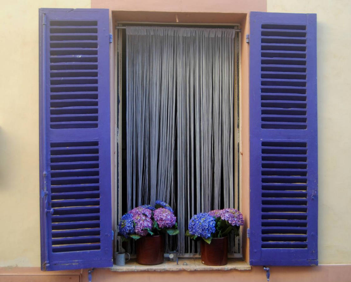 Solve Window with Purple Shutters jigsaw puzzle online with 80 pieces