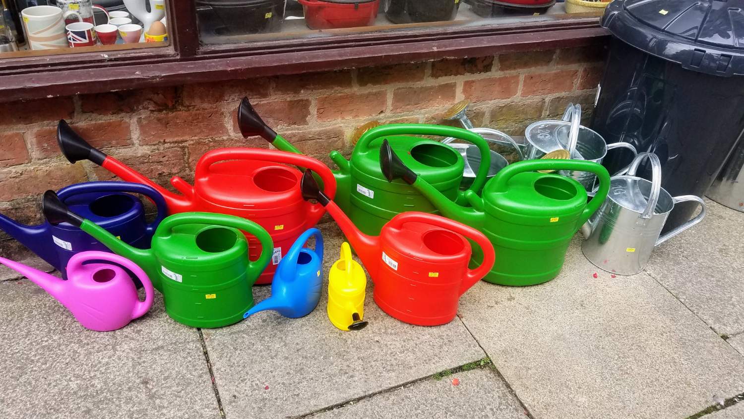 Solve Watering Cans for Sale jigsaw puzzle online with 60 pieces