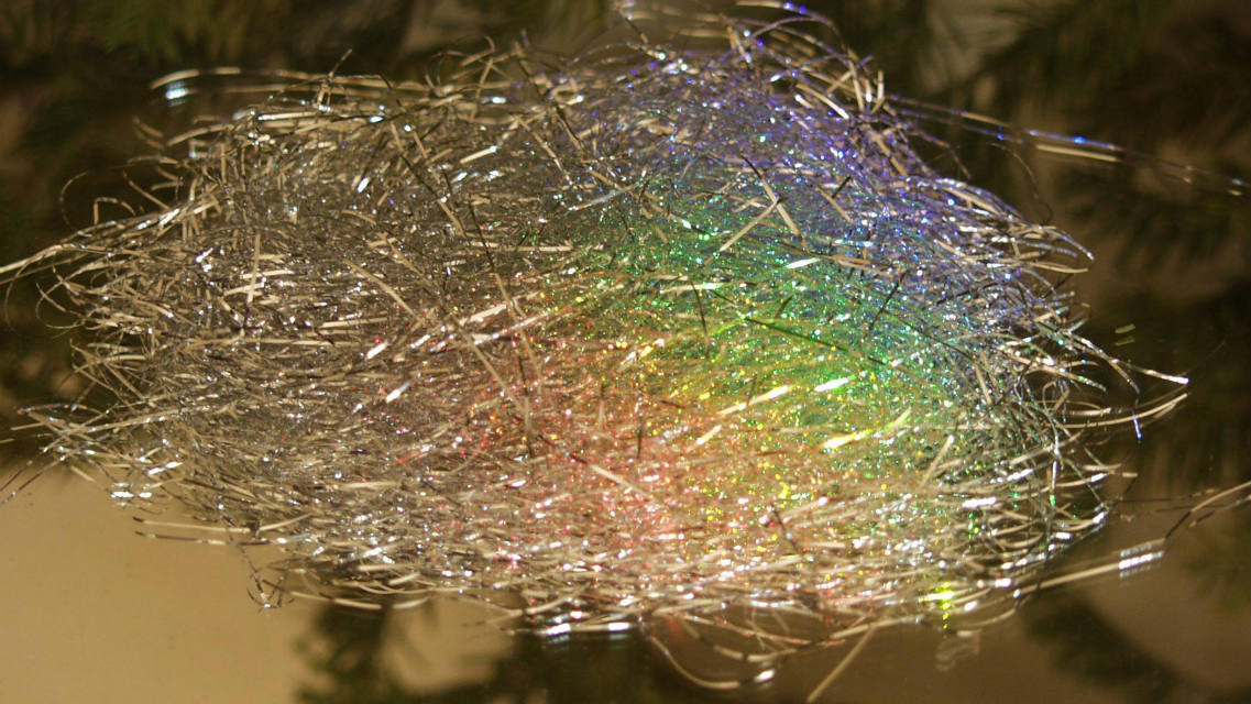 Solve Rainbow on Tinsel jigsaw puzzle online with 28 pieces