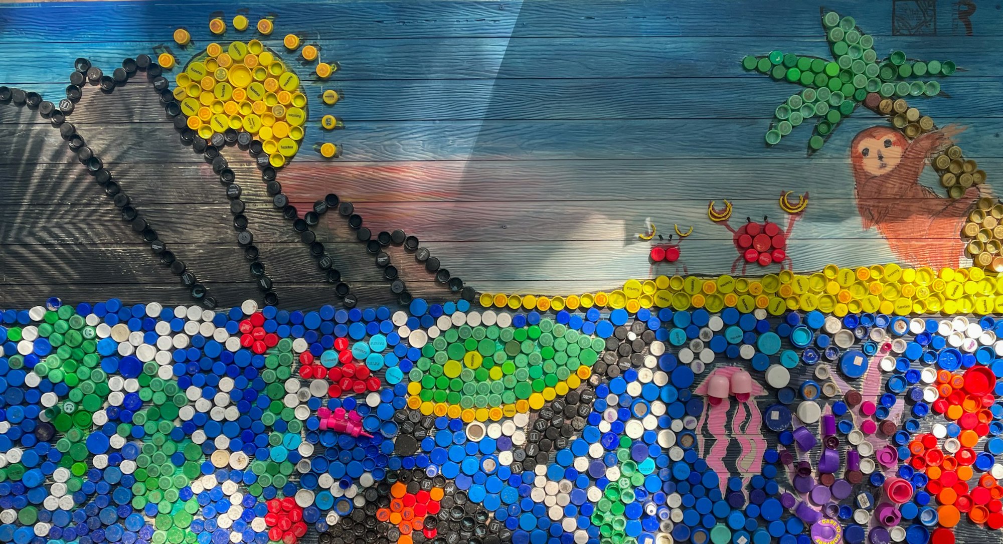 Solve Recycled bottle caps jigsaw puzzle online with 84 pieces