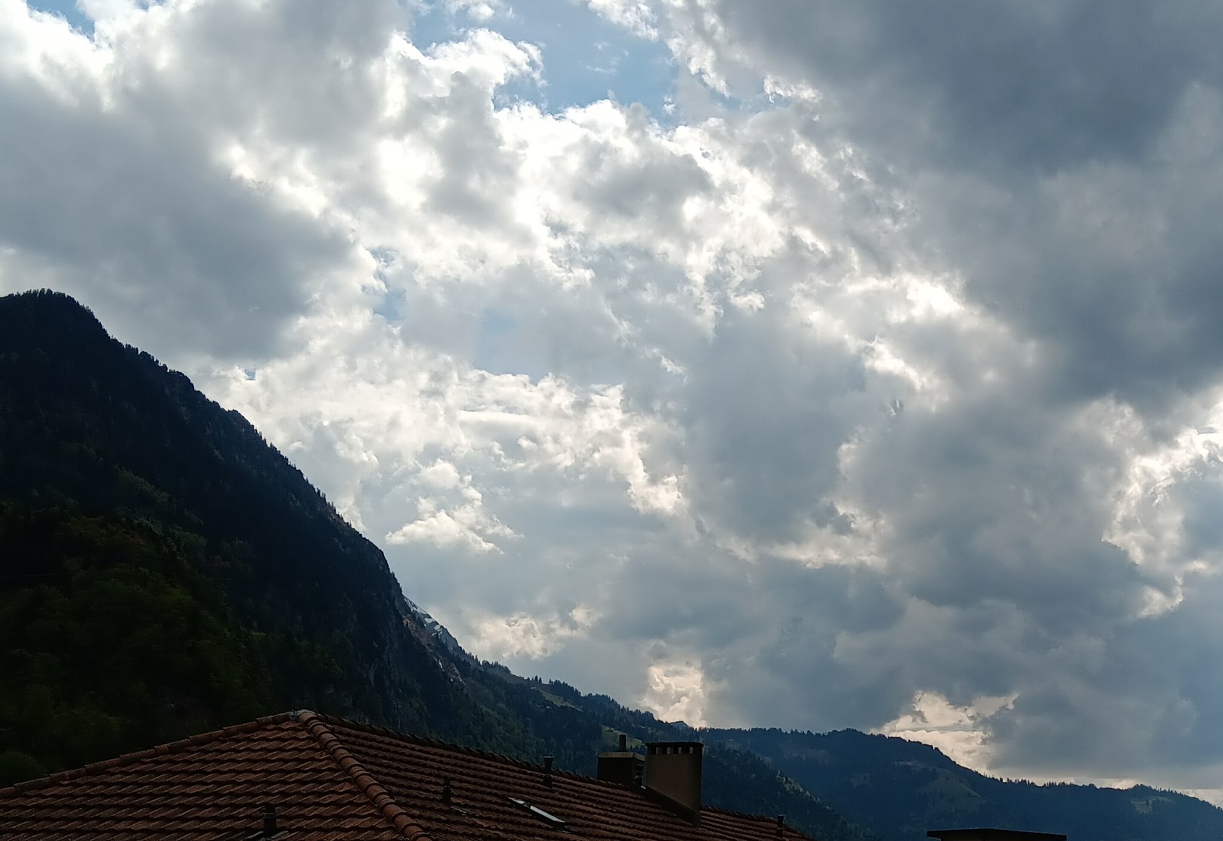 Solve Clouds over Interlaken Switzerland jigsaw puzzle online with 54