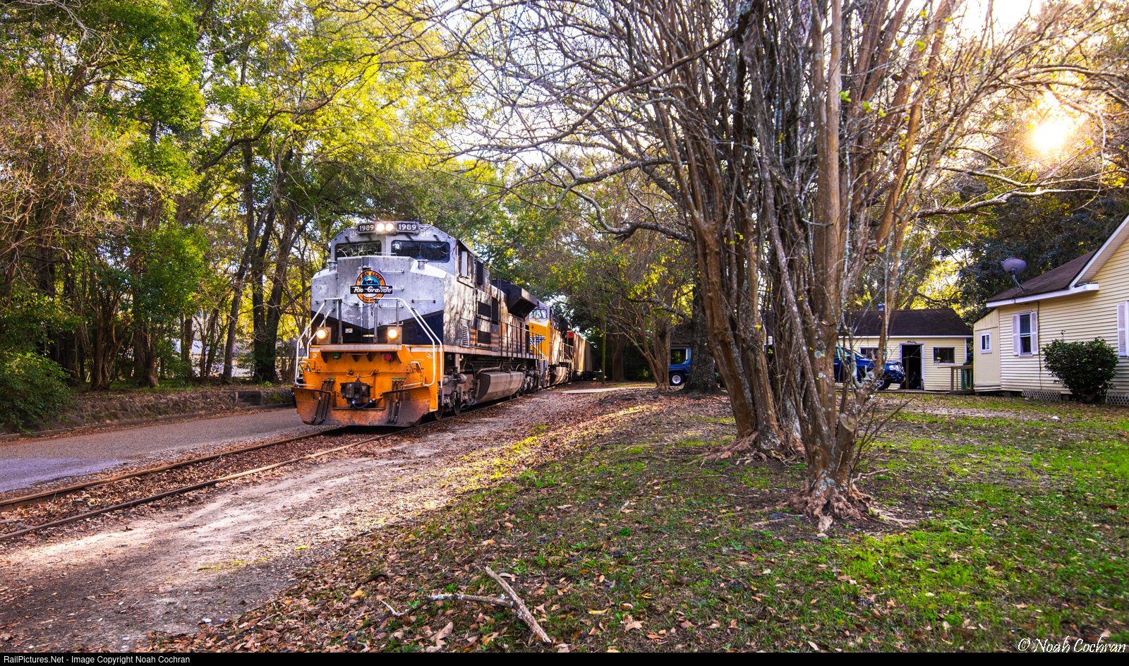 Solve running a train literally on railroad street how appropriate